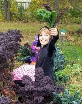 student holding plants