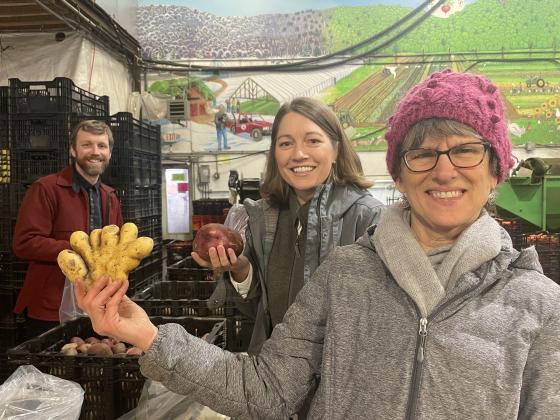 Volunteers joined by former Lieutenant Governor Molly Gray sorting winter storage culls at Pete’s Greens in Craftsbury