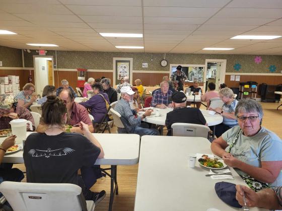 Community members eating the community lunch at the Barton Hub, 2024. The Barton Hub receives vegetables from the Produce to Pantries program. By Allyson Howell